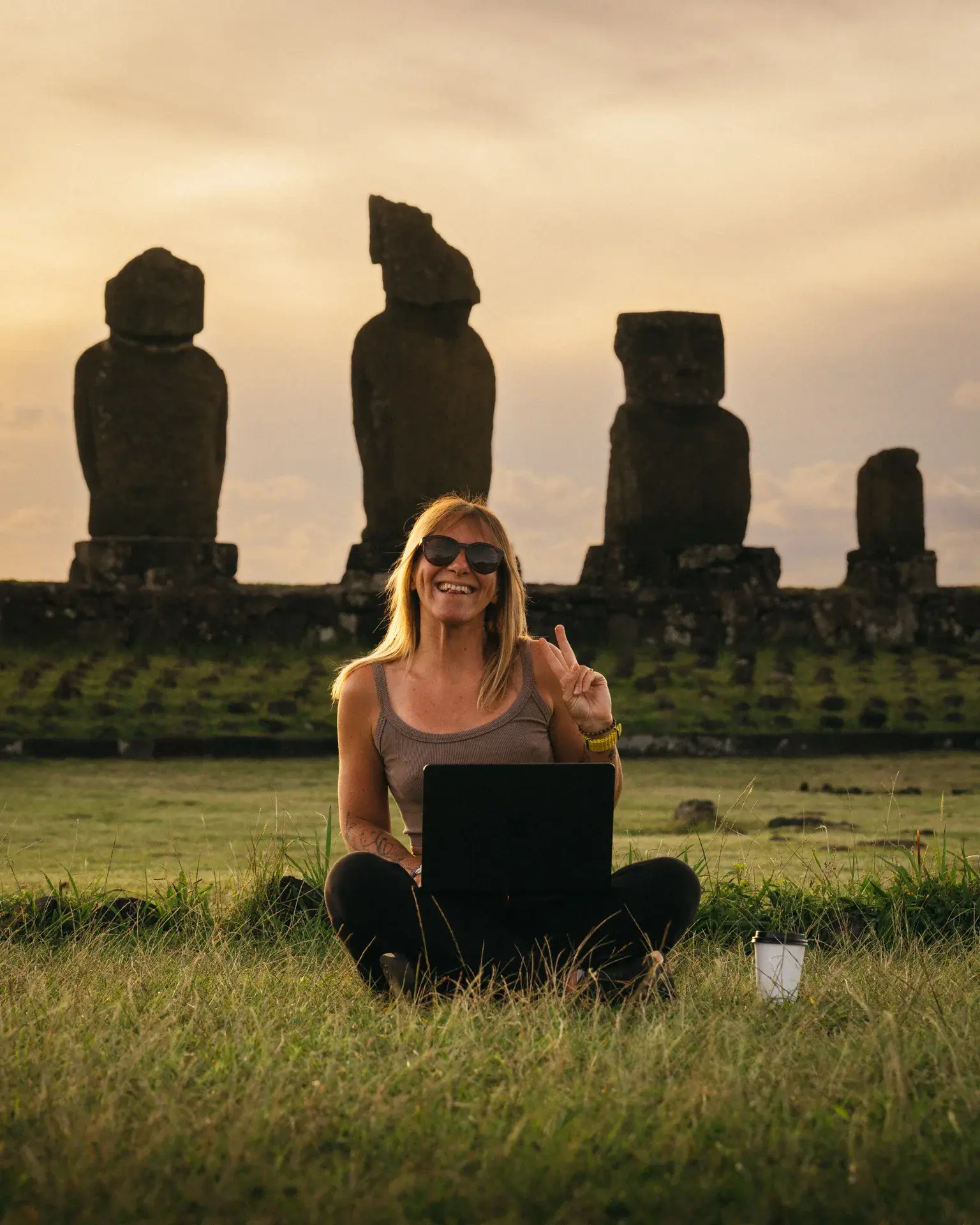 Patrycja working remotely near the Moai statues on Easter Island